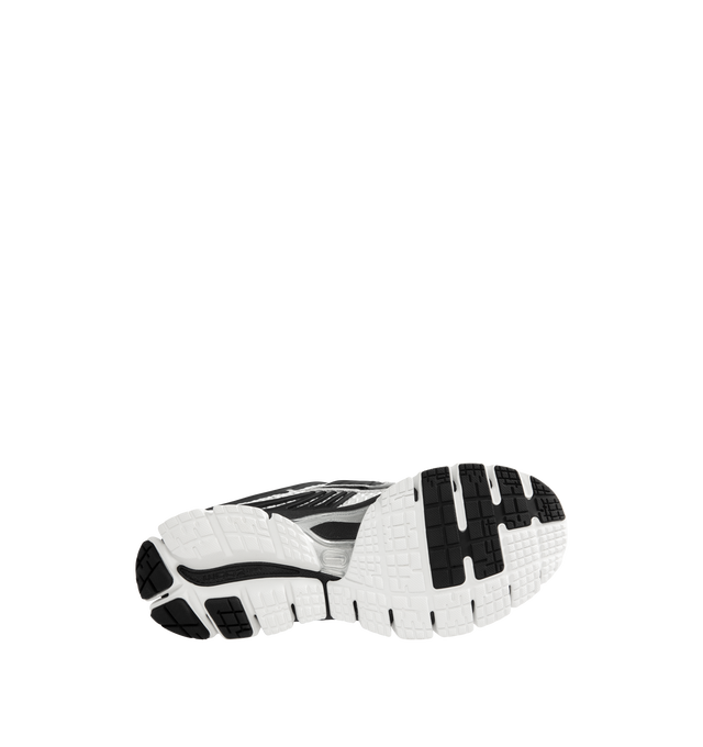 Image 4 of 5 - WHITE - Nike Men's Zoom Skylon 11 Shoes revive the late-2000s performance runner with an aerodynamic silhouette and advanced cushioning technology. Designed for comfort and everyday wear, this retro-inspired style features a chunky Air Zoom midsole with deep flex grooves and exposed cushioning pods that deliver a balanced combination of responsiveness, flexibility, and impact absorption. Materials: Textile & Synthetic upper. Midsole: Air Zoom Cushioning. 