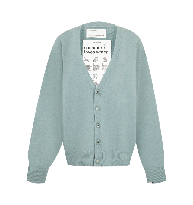 Image 1 of 2 - GREEN - EXTREME CASHMERE Jonah Sweater featuring a slouchy, relaxed-fit cashmere cardigan with a deep v-neck, fastened with five corozo buttons and rib-knit hem and cuffs. 94% cashmere, 5% nylon, 1% elastane. Every garment is offered in one size, designed to comfortably fit sizes XSXL. Each piece comes as is and is thoughtfully made to complement a wide range of body types. 