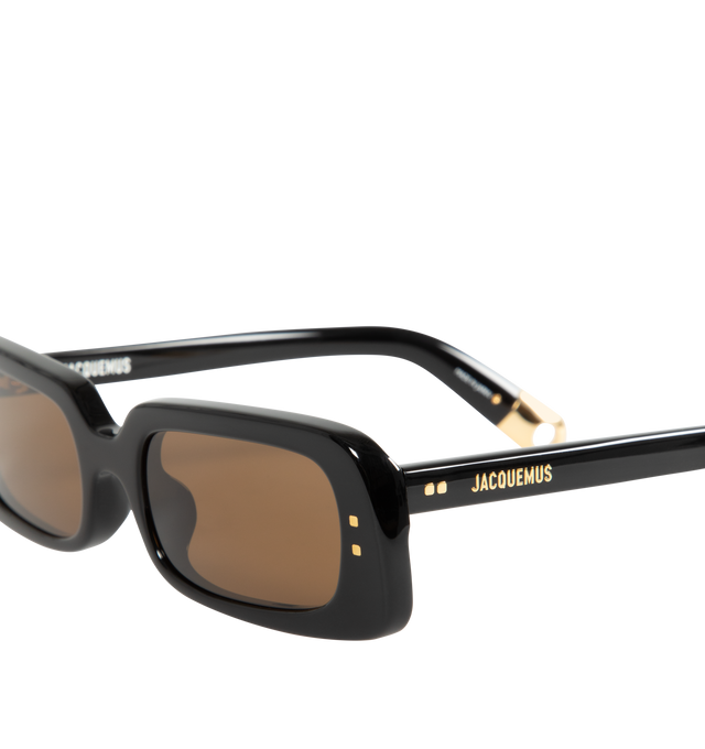 Image 3 of 3 - BLACK - Jacquemus X Linda Farrow Azzurro Rectangular Sunglasses have gray lenses, gold temple detailing, and acetate frames. 100% UV-protected solid lenses. Made in Italy. 