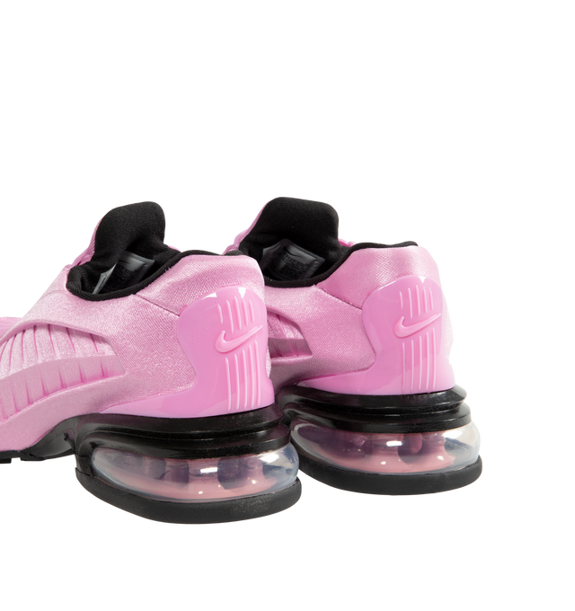 Image 3 of 5 - PINK - Nike Women's Air Max Dolce Shoes feature a laceless molded upper with an overlay cage and the distinctive Air Max silhouette. Designed for easy slip-on wear, the style is finished with visible Max Air cushioning in the heel for lightweight support and comfort. A foam midsole provides additional cushioning with every step. Midsole: Foam. Cushioning: Visible Max Air Unit. Closure: Slip-On.  