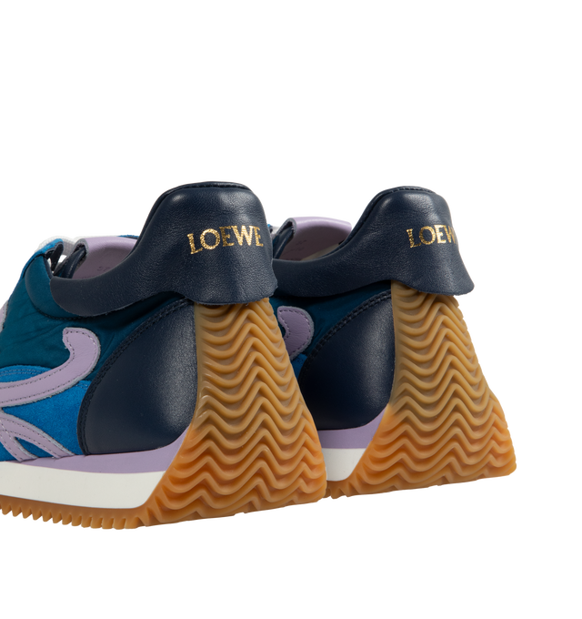 Image 3 of 5 - BLUE - LOEWE Flow Runner 2.0 featuring an updated ultra-flexible and lightweight construction, signature honey-coloured rubber outsole that extends from the toecap to the back of the heel, 25mm heel, signature L monogram on the side, embossed Anagram on the tongue and Gold embossed LOEWE on the heel tab. Runs a half-size larger. If between sizes, choose the smaller size. Nylon/Calf. Made in Italy.  