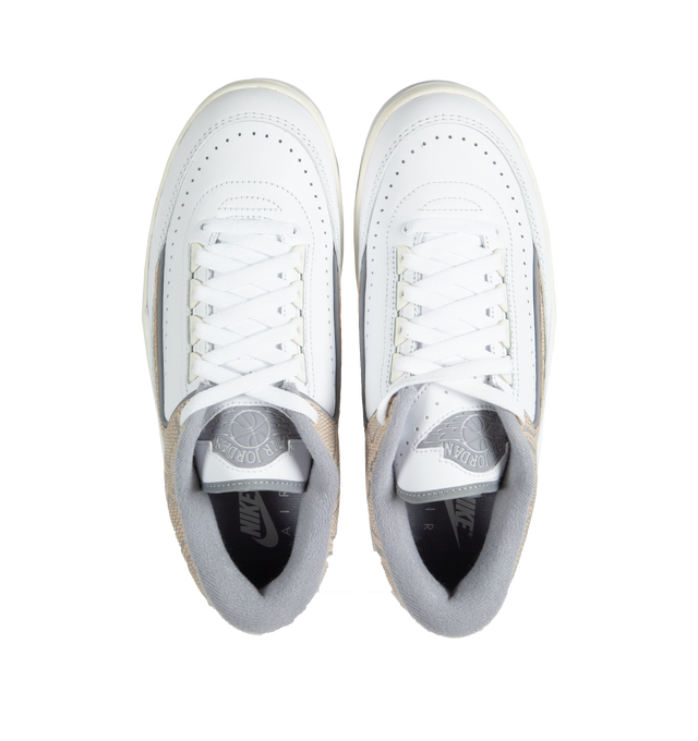 Image 5 of 5 - WHITE - AIR JORDAN 2  is famous for its sleek, pared-down design, now in a clean mix of white and Cement Grey, plus Sail accents for a hint of richness and python print overlays.  Crafted from premium leather and featuring an Air-Sole unit underfoot which absorbs impact for cushioning with every step. Leather in the upper breaks in easily and makes for a long-lasting shoe. Rubber outsole provides traction and durability. 