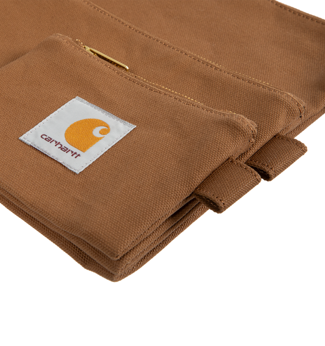 Image 3 of 3 - BROWN - CARHARTT WIP Canvas Pouch Set comprised of three pouches in different sizes, constructed from lined cotton Dearborn Canvas with a waxed finish, zip closure and a woven Square Label appears on each piece. Pouch 1: 10.2 x 8.3 inch. Pouch 2: 8.3 x 5.1 inch. Pouch 3: 5.1 x 3.5 inch. 100% cotton (Dearborn Canvas). 