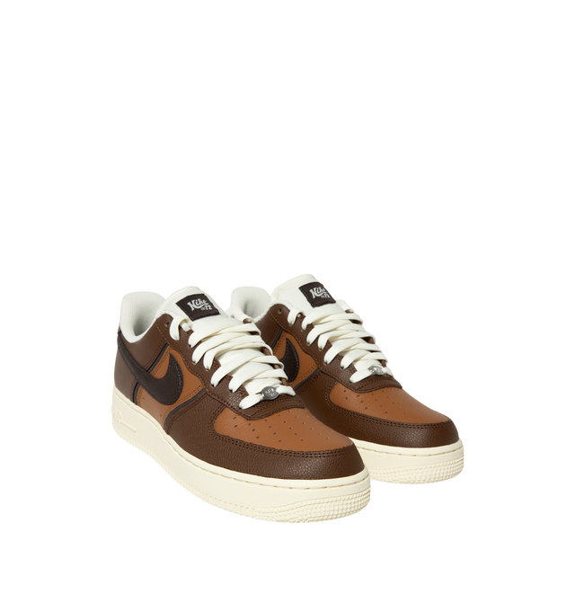 Image 2 of 5 - BROWN - Nike Men's Air Force 1 '07 LV8 Sneaker featuring classic silhouette with genuine and synthetic leather upper with perforated toe box, Nike Air unit, rubber outsole with classic pivot circles and padded collar. 