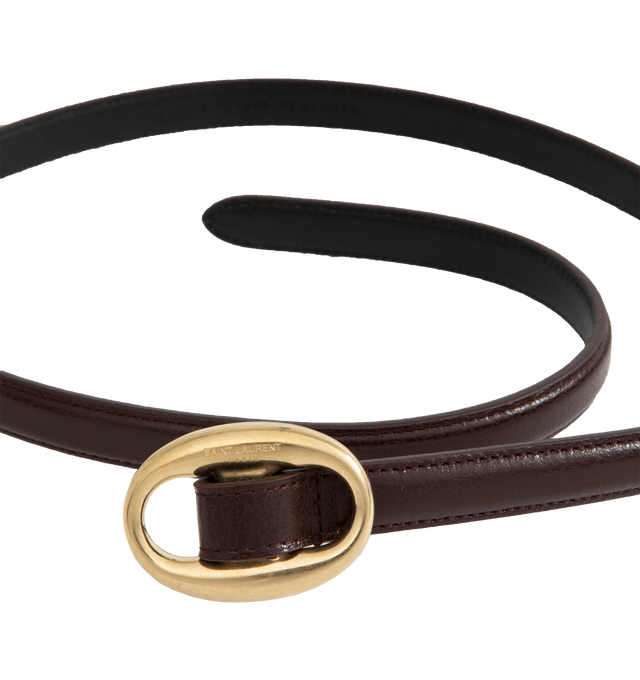 Image 2 of 2 - BROWN - SAINT LAURENT Oval Buckle Thin Belt featuring thin belt with an oval buckle engraved with the SAINT LAURENT PARIS signature, gold-toned hardware and adjustable buckle closure. Dimensions: 1.5 cm. Calfskin. 