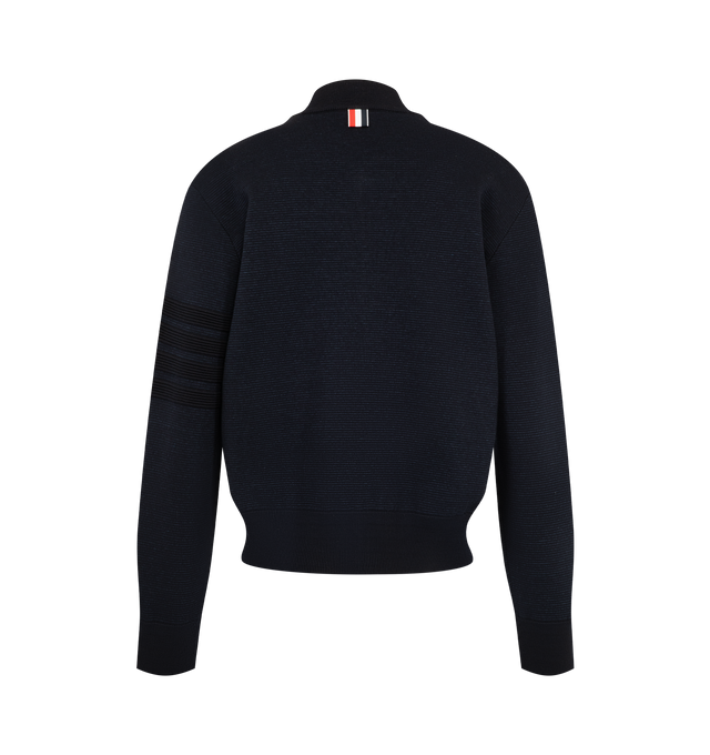 Image 2 of 3 - NAVY - Thom Browne Women's Ottoman Milano Stitch 4-Bar Bomber Jacket is crafted from wool and features the brands signature 4-bar detailing rendered in a raised ottoman-stitch construction along the sleeve. Designed with a refined bomber silhouette, the jacket is finished with a two-way zip closure, rib-knit bomber collar, cuffs, and hem, and welt hand pockets with rib-knit trim. Thom Brownes signature striped grosgrain loop tab completes the design. Main Material: Wool. Made in Italy. 
