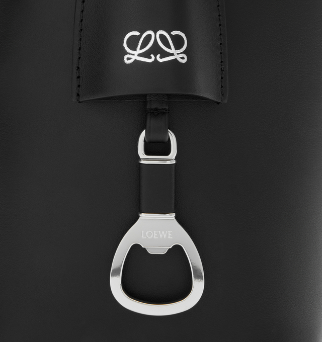 Image 5 of 5 - BLACK - LOEWE Medium Bilbao Bucket Bag in smooth calfskin featuring a trapeze shape bucket bag with a minimalist and graphic design, shoulder or crossbody carry, adjustable strap, detachable double L-embossed leather bell with concealed functional bottle opener, additional external d-ring for personalisation, hook closure to secure belongings, suede lining and embossed LOEWE. Smooth calf. 24 cm x 13 cm x 25 cm. Made in Spain. 