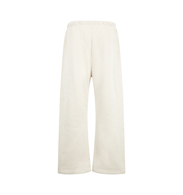 Image 2 of 3 - WHITE - Fear of God ESSENTIALS Men's Signature Flare Sweatpant is crafted from heavyweight 380 GSM cotton-blend fleece and features a relaxed-fit silhouette that extends into a flared leg. Designed with the Essentials signature logo embroidered at the leg, this elevated loungewear style is finished with an encased elastic waistband, elongated drawcords, side-seam pockets, and a signature Essentials label at the center front. Main Material: 80% Cotton, 20% Polyester, 380 GSM.  