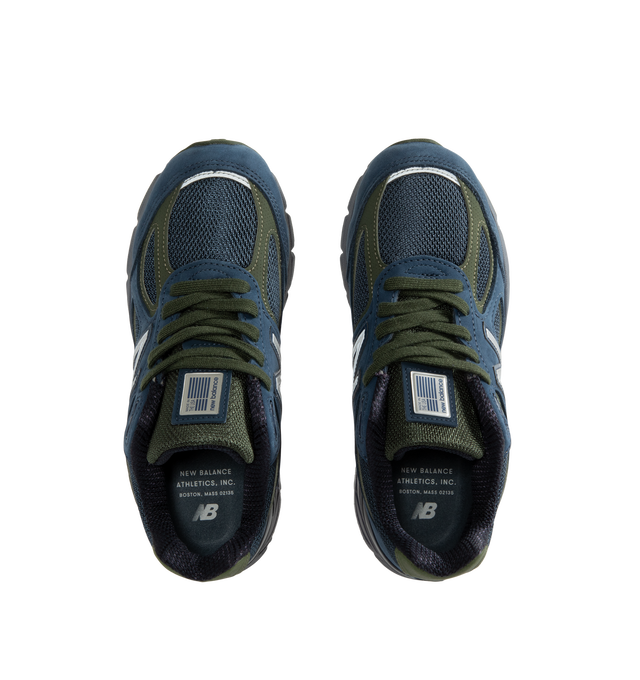 Image 5 of 5 - NAVY - New Balance Unisex Made in USA 990v4 Sneakers feature the iconic silhouette that has defined premium running-inspired footwear since its debut in 1982. Originally introduced in 2016, the 990v4 further refined the modernization of the classic design with a premium combination of mesh, nubuck leather, and synthetic overlays. Finished in a versatile grey and navy color palette, this Made in USA edition is equipped with ENCAP midsole cushioning that combines lightweight foam with a durable 