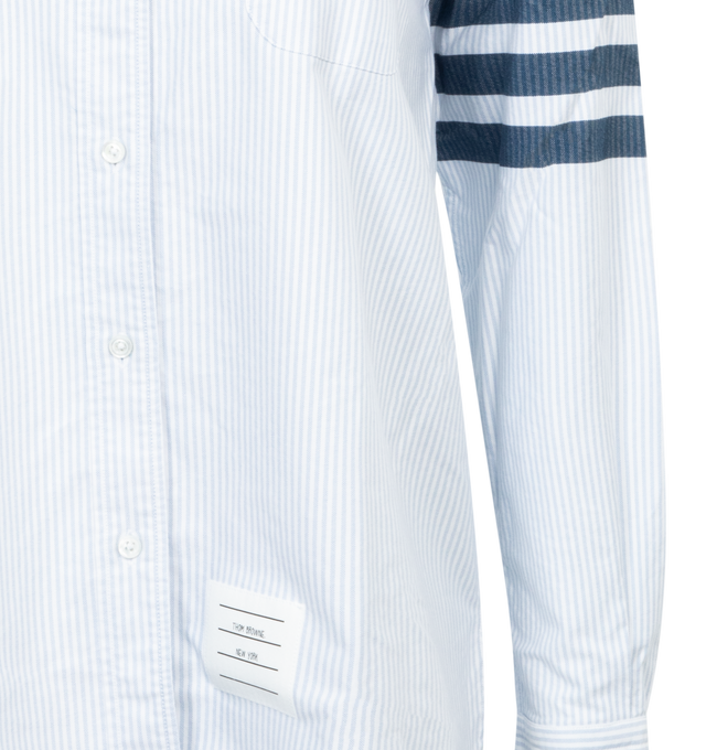 Image 3 of 3 - BLUE - Thom Browne essential cotton shirt with meticulous tailoring. Features front button closure, 4-Bar detail at one sleeve, patch chest pocket, name tag applique above hem at the front, seamed back yoke with locker loop and signature striped grosgrain loop tab. 100% Cotton. 