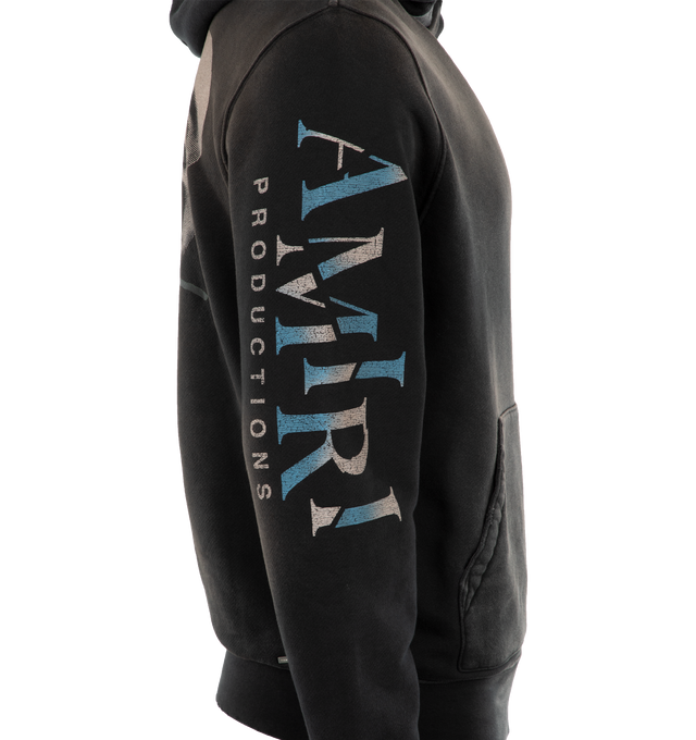 Image 3 of 4 - BLACK - AMIRI Theatre Masks Hoodie featuring  Amiri Productions logos on the chest and sleeves, theatrical comedy and tragedy masks adorn the back, faded washed effect, hooded, long sleeves, kangaroo pocket and pulls over. 100% cotton. 