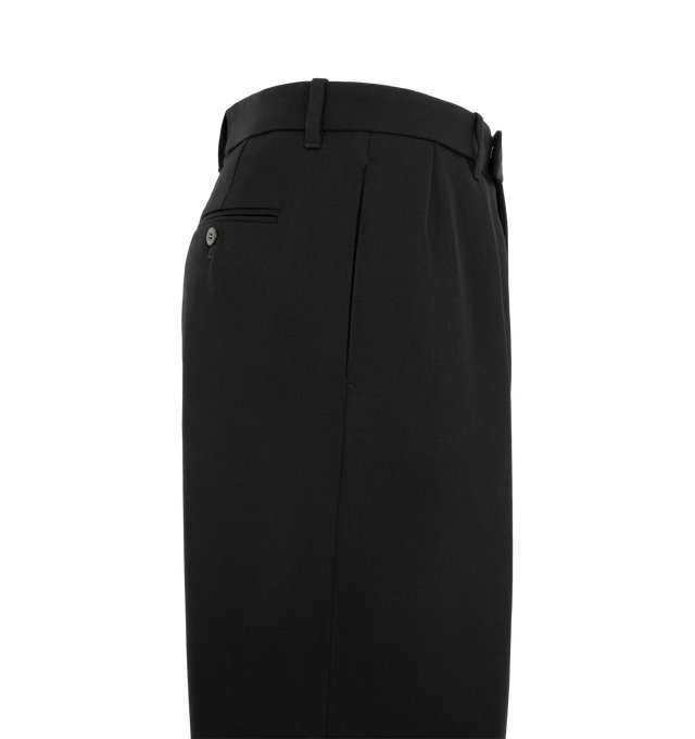 Image 3 of 3 - BLACK - The Willy Chavarria Men's Vestimenta Pleated Trouser is cut in a tailored, wide-leg silhouette with double knife pleats at the front for a defined shape. Crafted from 100% virgin wool, it features in-seam pockets and welt pockets at the back. Finished with a key loop and a signature W at the center back. 