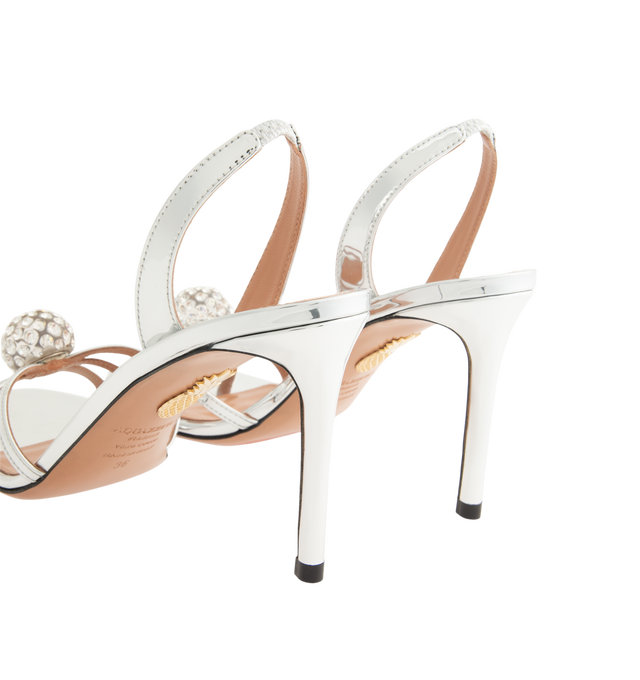 Image 3 of 4 - SILVER - Aquazzura Women's Crystal Bubble Sandal 85 is designed with slender straps embellished with shimmering crystal spheres for a striking, jewelry-inspired finish. Set on a sleek 85mm stiletto heel, these designer sandals feature a high-shine gold finish and an elasticated slingback strap for a secure, comfortable fit. Heel Height: 85 mm. Made in Italy. 