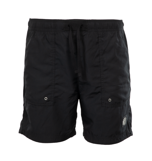 BLACK - STONE ISLAND Swim Trunks featuring regular fit, patch hand pockets with slanting opening edged with inner tape, back patch pocket with fixed flap and hidden zipper closure with nylon trim, Stone Island Compass patch logo on the left leg, inner mesh lining and elasticized waistband with outer drawstring set on tap tab. 100% polyester. Lining: 100% polyamide/nylon.