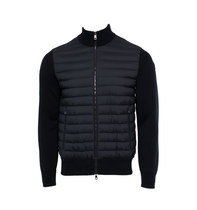 NAVY - MONCLER Padded Zip Up Cardigan featuring Gauge 18, down-filled longue saison front, zipper closure, double knit sleeves and back and leather logo patch. 100% polyamide/nylon. 87% cotton, 12% polyamide/nylon, 1% elastane/spandex. Padding: 90% down, 10% feather.