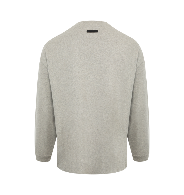 Image 2 of 2 - GREY - Fear of God Essentials Heavy Long Sleeve T-Shirt has a crew neck, an oversized fit, and brand label and graphics. 100% cotton.  