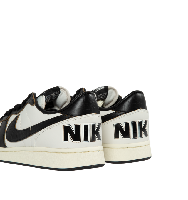 BLACK - NIKE TERMINATOR LOW PRM features leather and suede in upper, rubber outsole, perforations on toe, padded collar, exposed stitching on side panels and foam midsole.
