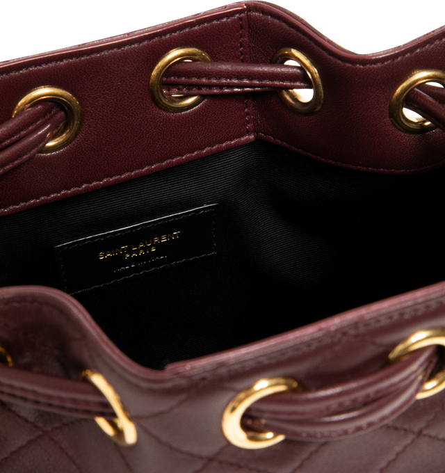 Image 3 of 3 - RED - SAINT LAURENT Chain Bucket Bag in quilted lambskin featuring a jewelry chain strap for shoulder carry, leather lining, bronze-tone hardware and drawstring closure. 6.3" x 7.1" x 3.9". Strap drop: 15.7". Lambskin. Made in Italy. 