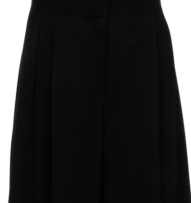 Image 4 of 4 - BLACK - THE ROW Paras Pant featuring a mid-rise tailored pant in fine wool gabardine with wide leg, voluminous side pleats, and side seam pockets. 100% wool. Silk lining. Made in Italy. 