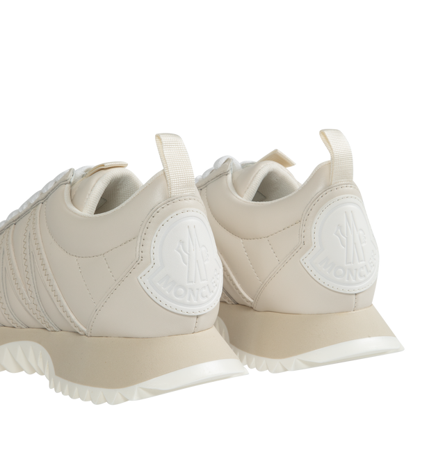 Image 3 of 5 - WHITE - MONCLER Pacey Bicolor Runner Sneakers featuring round toe, lace-up vamp, debossed tongue logo, logo emblem at backstay, M-logo stitch detail on the sides and rubber outsole. Leather. Made in Italy. 