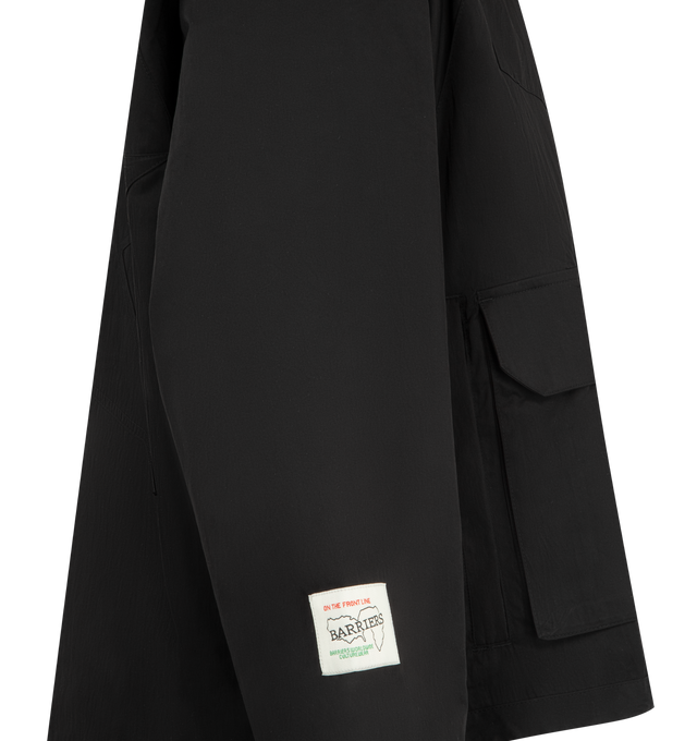 Image 3 of 3 - BLACK - BARRIERS WORLDWIDE Star Hooded Nylon Jacket featuring hooded nylon jacket, full lining and front patch pockets, slightly cropped fit, drawstring adjustable hem and star stitch detailing at back. Nylon.  