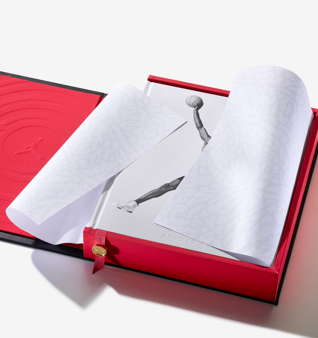 Image 14 of 20 - MULTI - Assouline celebrates 40 years of Air Jordan with a landmark Ultimate volume, created in collaboration with Michael Jordan and the Jordan Brand. This collectors piece honors the enduring influence of Michael Jordan and the brand that reshaped sport, style, business, and culture worldwide.Limited to 1,000 hand-numbered copies, the Ultimate edition is crafted with a host of bespoke details. Encased in an intricately tooled leather clamshell, the cover features Baroque-inspired embossin 