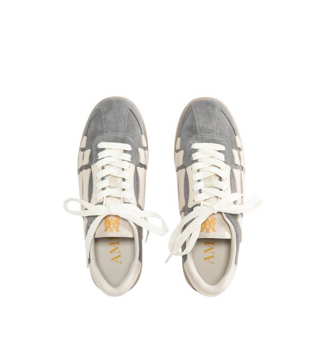 Image 5 of 5 - GREY - AMIRI Pacific Bones Sneakers in suede featuring low-top, signature bone appliqus on the sides, flat heel, round T-toe, lace-up vamp, woven MA tongue label, backstay logo and rubber outsole. 