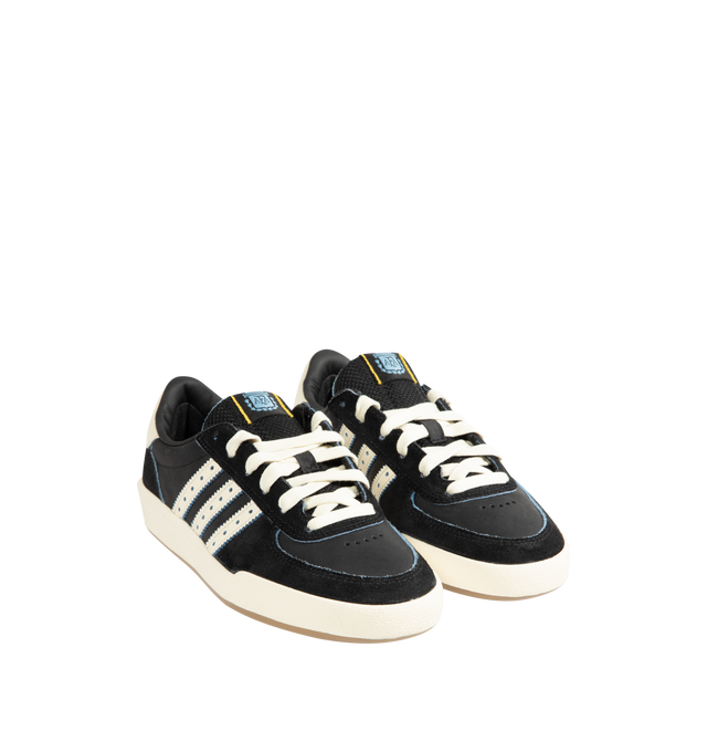 Image 2 of 5 - BLACK - Adidas Mens Glenburn x Thrasher Sneaker is crafted from suede and leather with a rubber sole. Features a lace-up closure, padded tongue with logo patch detail, padded low-cut collar, signature stripes with perforated trim, almond toe, and includes spare laces. Suede and leather upper with rubber sole. Made in Vietnam. 