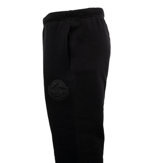 Image 3 of 4 - BLACK - MONCLER GENIUS MONCLER X ROC NATION BY JAY-Z SWEAT BOTTOMS are sweat bottoms that have an elastic waistband and hem at the legs with side slit pockets. Fits true to size. 100% cotton. 