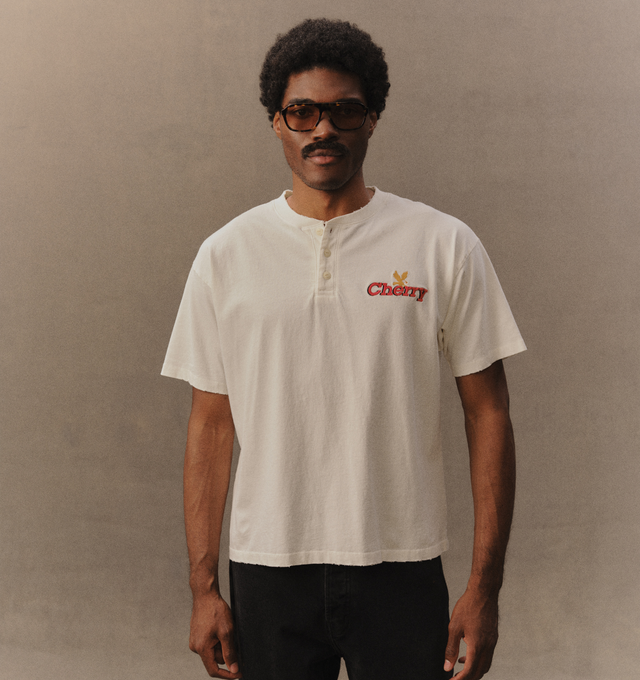 Image 4 of 6 - WHITE - Cherry LA Men's Henley T-Shirt is crafted from cotton and features a boxy-fit silhouette with a classic Henley neckline. Designed with embroidered detailing at the front, this elevated everyday essential combines relaxed proportions with signature Cherry LA styling. Main Material: Cotton. Made in Los Angeles, California. 