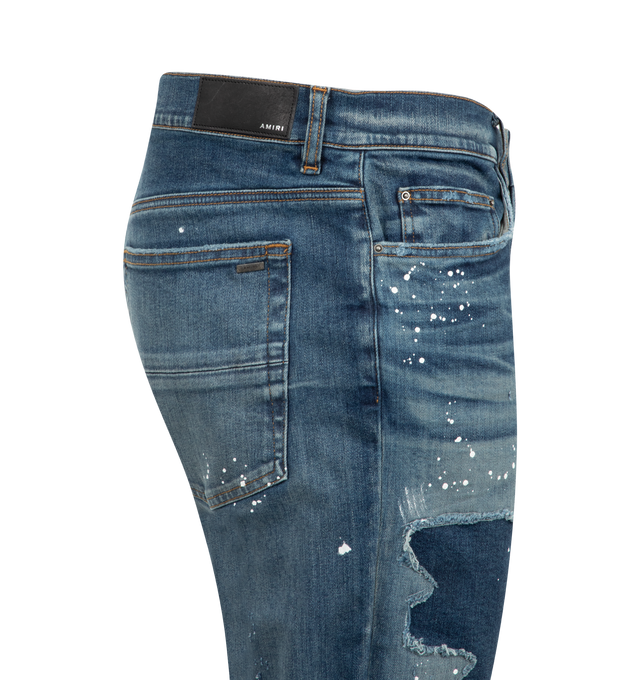 Image 3 of 3 - BLUE - Amiri Lounge Skinny Jeans are a 5-pocket style with crystal-embellished fabric patches, distressing, and paint spatters. Made in USA.  