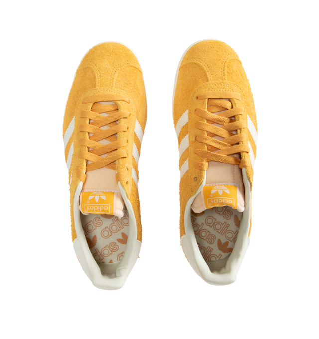 Image 5 of 5 - YELLOW - Adidas Classic Gazelle Sneakers are a lace-up style with satin uppers, suede and synthetic overlays, and gum outsoles. Textile linings.  