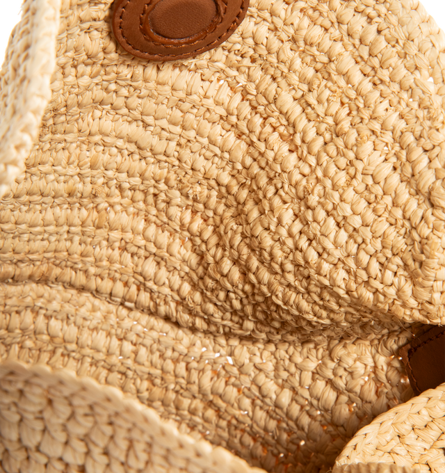 Image 3 of 3 - BROWN - SAINT LAURENT Gaby Raffia Bucket Bag featuring bucket bag in woven raffia with a semi-rigid construction, decorated with the cassandre on front, a magnetic double-flap closure, top handle in vegetable-tanned leather, a detachable leather-and-chain strap for multiple carry options, bronze-tone hardware and one card slot. 6.3" X 7.5" X 4.7". Raffia, brass, leather. Made in Madagascar. 