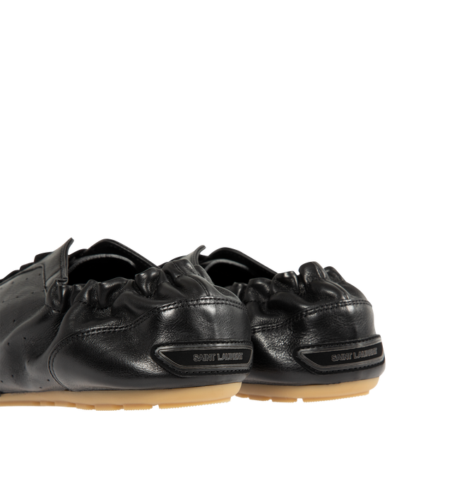 Image 3 of 5 - BLACK - SAINT LAURENT Lewis Sneakers featuring low-top laced sneakers, an elasticized heel counter, supple sole and logo signature patch at the back. Calfskin. Made in Italy. 