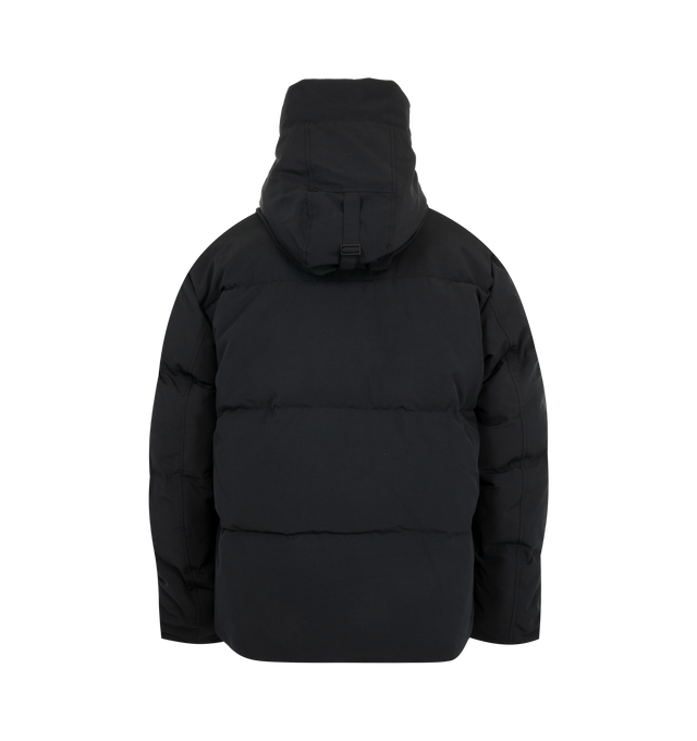 Image 3 of 4 - BLACK - Canada Goose Men's Seymour Parka is crafted from Recycled Organic Arctic Tech and features a quilt-through construction designed for protection in extreme cold-weather conditions. The parka is equipped with an adjustable snorkel hood, a tricot-lined chin guard, and a concealed snap placket over a front zip closure for enhanced coverage. Functional details include interior backpack straps for hands-free carrying, recessed rib-knit cuffs reinforced with CORDURA, two exterior zip pockets 