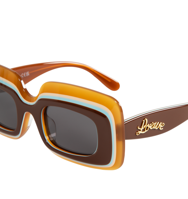 Image 3 of 3 - BROWN - LOEWE PAULA'S IBIZA Layered Sunglasses featuring acetate rectangle frames layered with contrasting stripes and are stamped with cursive logo lettering along the temples. 100% UV protection. 