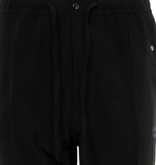 Image 4 of 4 - BLACK - NEEDLES Cowboy Trousers featuring stretch polyester twill, drawstring at elasticized waistband, four-pocket styling, zip-fly, embroidered logo at front leg, pinched seam at legs and piping at outseams. 89% polyester, 11% polyurethane. Made in Japan. 