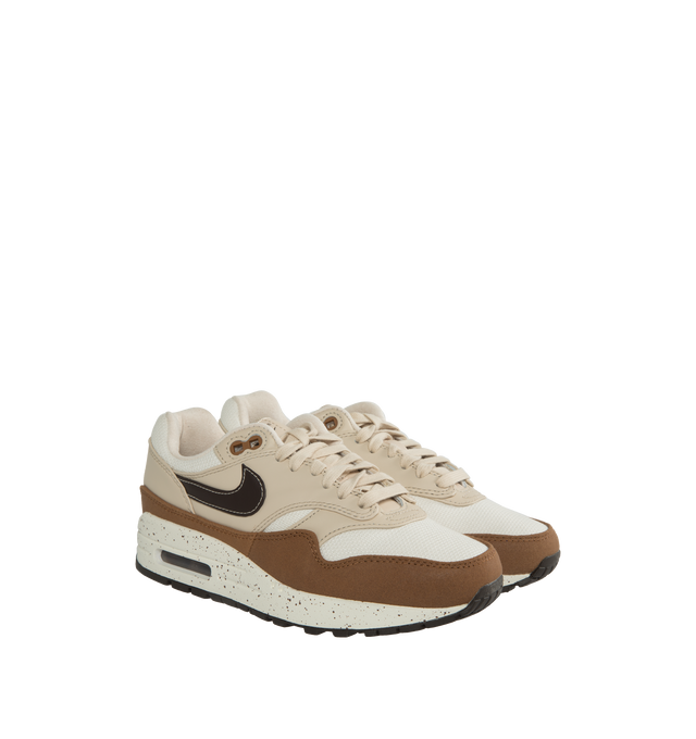 Image 2 of 5 - BROWN - NIKE Air Max 1 '87 Sneakers featuring low-top, canvas, nubuck, and buffed leather, lace-up closure, logo patch at padded tongue, padded collar, swoosh appliqu at sides, logo embossed at heel counter, faux-suede and mesh lining, Air Sole unit at rubber midsole and treaded rubber sole. Upper: textile, leather. Sole: rubber. Made in China. 