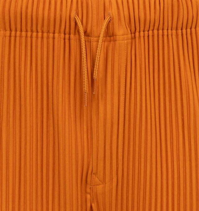 Image 4 of 4 - ORANGE - ISSEY MIYAKE Pants featuring a relaxed, wide leg, two side pockets, and an elastic drawstring waist. 100% polyester. 