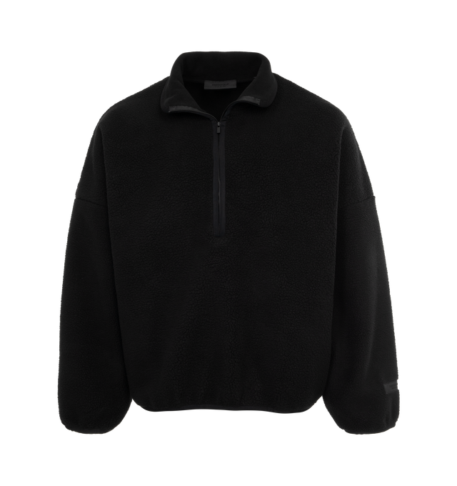 Image 1 of 2 - BLACK - FEAR OF GOD ESSENTIALS Seal Polar Fleece Half Zip Sweatshirt featuring relaxed fit, a mock neckline, long sleeves, a half-zip front closure, dropped shoulders, a polar fleece construction and a rubber brand label at the upper back and wrist cuff. 100% polyester. 