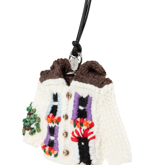 Image 3 of 3 - MULTI - JW Anderson knitted cardigan charm in white Italian wool machine-knit. Inspired by the house cardigans from the Resort 2025 show. Features hand-embroidered details in mercerised cotton yarn finished with a silver-finish metallic coat hanger attachment, logo-engraved medallion and leather cord. 90% Wool, 10% Cotton, Split Grain Calf Leather trim, 100% Coconut Shell trim. Made in Georgia. 