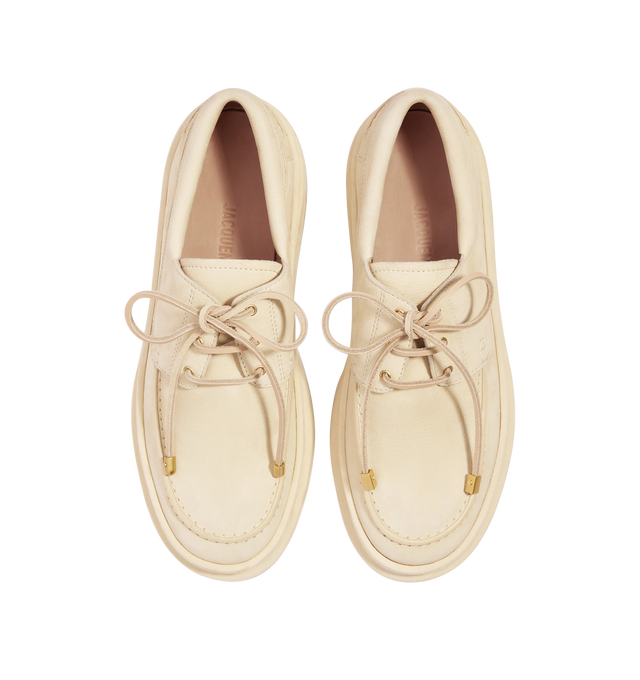 Image 2 of 2 - NEUTRAL - JACQUEMUS Double Boat Shoes featuring nubuck leather boat shoes, leather laces with circle and square tips, split upper with topstitching, topstitched seams, embossed logo on insole and notched rubber soles. 100% cowskin. Sole: 100% rubber. Made in Italy. 