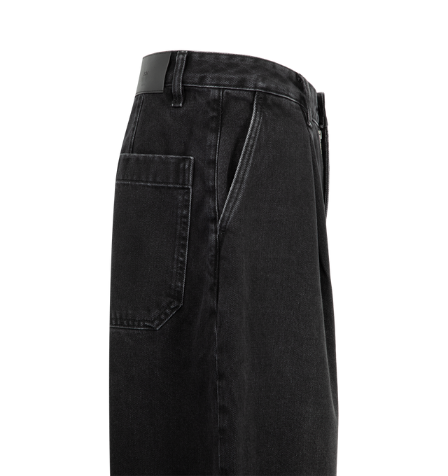 Image 3 of 3 - BLACK - Studio Nicholson Puch Denim Pant is crafted from rigid Italian denim and features a mid-rise, oversized silhouette defined by exaggerated volume and sharp single pleats. Designed with a wide-leg shape, wide cuffs, welt front pockets, U-line back pockets, and a zip-fly with button closure, the pant delivers the brand's signature architectural approach to tailoring. Main Material: 100% Organic Cotton. Made from 13oz Italian Denim. 