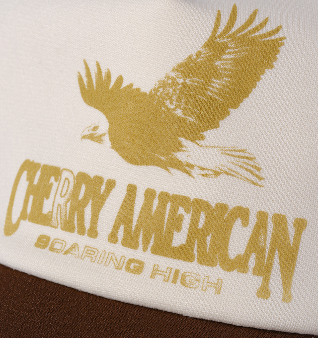 Image 3 of 7 - BROWN - Cherry LA Golden Eagle Trucker Hat is crafted from polyester and features a classic trucker silhouette with a screen-printed Golden Eagle graphic at the front and embroidered detailing at the back. Main Material: Polyester. Fit: Adjustable. Closure: Plastic Snapback Closure. Made in Los Angeles, California. 
