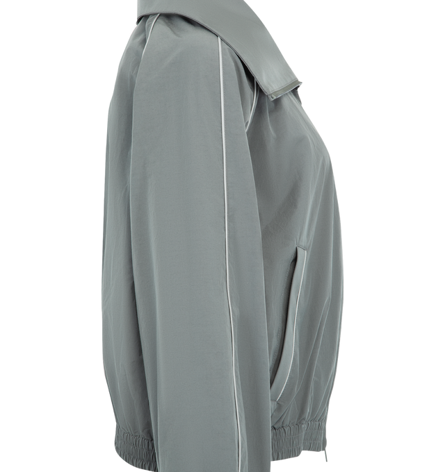 Image 3 of 3 - GREY - BALENCIAGA High Collar Tracksuit Jacket featuring techno cotton poplin, a long high stand up collar, double-ended zip fastening, dropped shoulders, reflective piping, 2 zipped slash pockets, gathered cuffs and waistline and reflective effect artwork printed on the chest. 50% cotton, 50% polyamide. Lining: 100% polyester.  Made in Italy.  