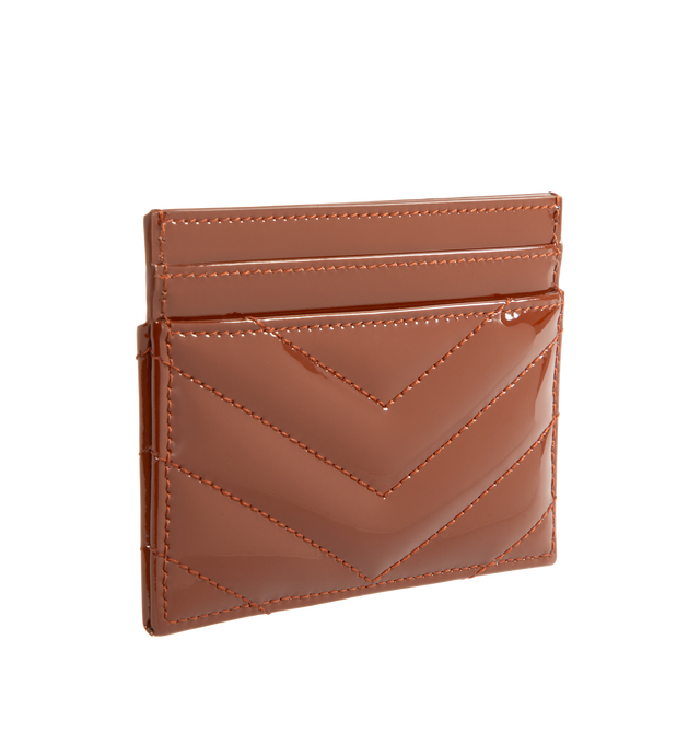Image 2 of 3 - RED - Saint Laurent Women's Cassandre Card Case is crafted from glazed brown patent calfskin leather and features quilted topstitching, bronze-tone Cassandre hardware, and five card slots. Main Material: Calfskin Leather. Hardware: Brass. Dimensions: 10.5 x 7.5 x 0.5 cm / 4.1 x 3 x 0.2 in. Made in Italy. 