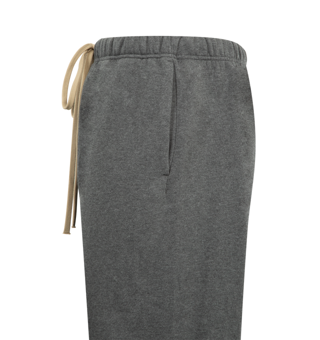 Image 3 of 3 - GREY - FEAR OF GOD ESSENTIALS Flare Sweatpant featuring 480gsm core fleece, cut in a relaxed silhouette that extends into a flared leg, encased elastic waistband with elongated drawcords, side seam pockets and a Fear of God Essentials rubberized label stitched at the center front. 80% cotton, 20% polyester.  
