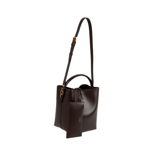 Image 2 of 3 - BROWN - SAINT LAURENT Le 37 Bucket Bag featuring metal cassandre hook closure, one zipped pouch, suede lining, and four metal feet. 20 X 25 X 16cm. Handle drop: 9cm. Strap drop: 40cm. 100% calfskin leather. Made in Italy.  