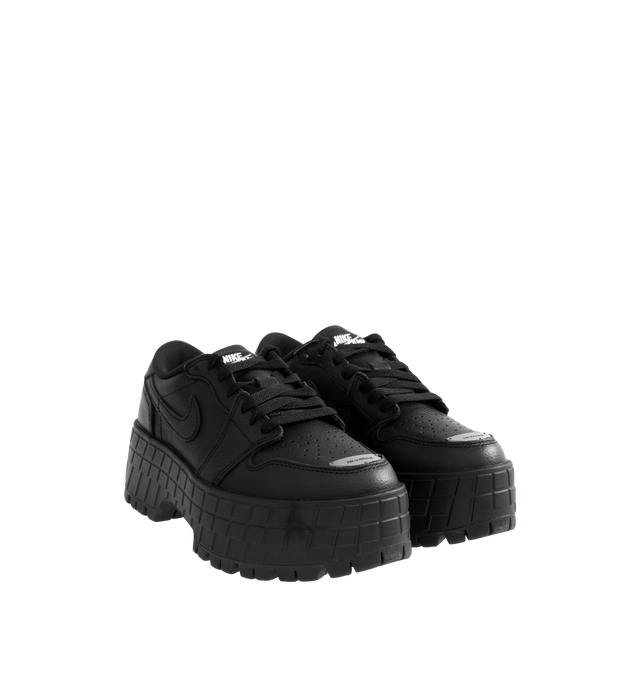 Image 2 of 5 - BLACK - JORDAN Air Jordan 1 Brooklyn Low Sneaker featuring genuine full-grain leather in the upper, Nike Air in the heel, foam midsole, perforated toe box and elevated lugged rubber outsole adds height and extra comfort. 