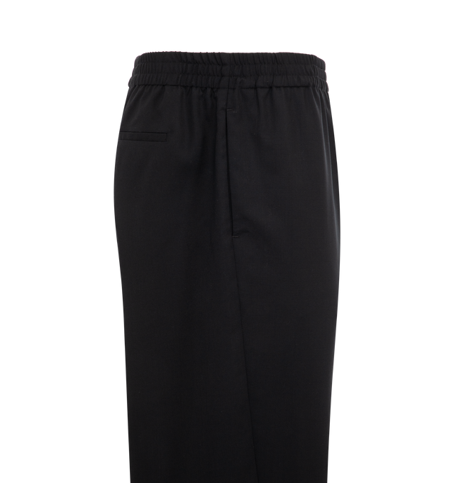 Image 3 of 3 - BLACK - The Row Men's Konan wool full-length trousers with elasticated waistband, two side inset pockets, rear welt pocket and wide leg. Made in Italy. Wool 100% with 100% Cotton lining. 